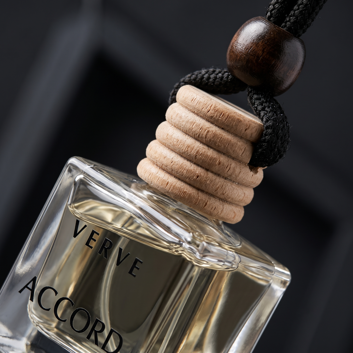 Extreme close-up macro of VERVE Accord grooved beechwood cap and thick glass bottle