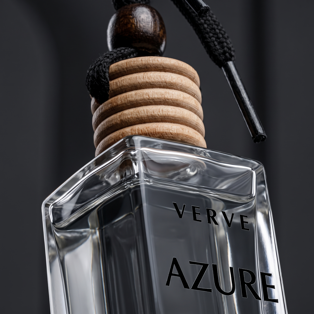 Macro close-up of VERVE grooved wood diffuser cap and thick glass bottle
